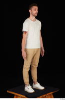  Trent brown trousers casual dressed standing white sneakers white t shirt whole body 0016.jpg
